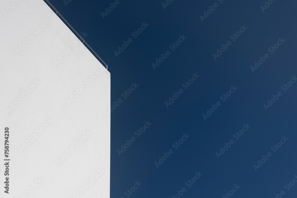 modern white wall with blue sky background modern white wall with blue sky background