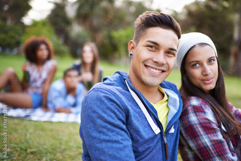 Fototapeta premium Couple, smile and portrait with love in park with bonding and fun on campus outdoor. Students, grass and happy together in a university garden on break on a picnic with college people with hipster