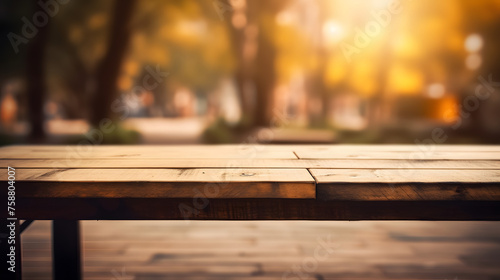 Empty wooden table in front of blur background