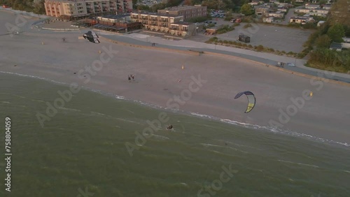 Aerial view of kitesurfing on the sea during sunset, Netherlands
