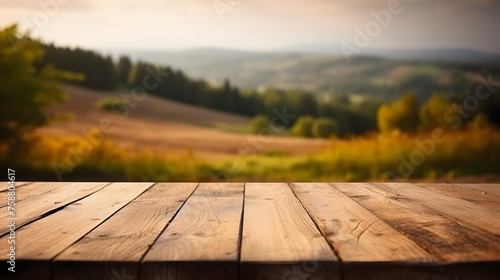 Empty wooden table in front of blur landscape background