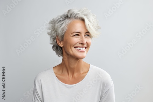 beauty, people and health concept - smiling senior woman in blank white t-shirt over grey background