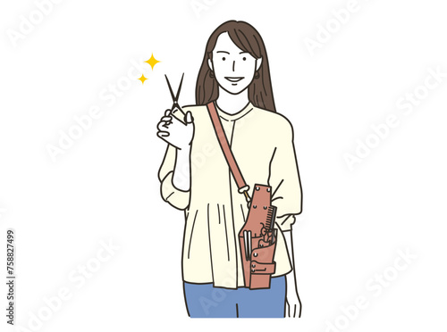 散髪ハサミを持つカメラ目線の美容師の女性