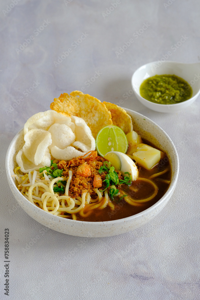 emie, Indonesian noodle with shrimp broth, dry shrimp, , fried onion,onion leaves, bolied potatoes, egg and crackers emie, Indonesian noodle with shrimp broth, dry shrimp, , fried onion,onion leaves, bolied potatoes, egg and crackers