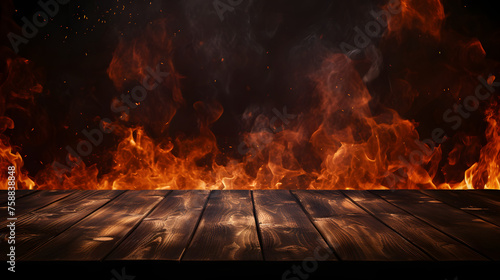 wooden table with Fire burning on a dark background