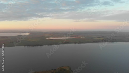 Aerial view of small island in lake with docked boats at dawn, Gaastmeer, Netherlands photo