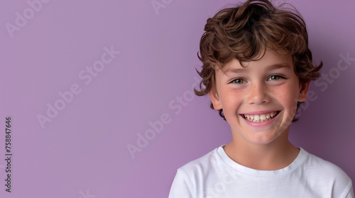 One smiling teeth 8 yr old country boy Australian kid wavy brunette brown hair caucasian skin confident schoolboy kid isolated pediatric dentistry healthcare child purple background copy space