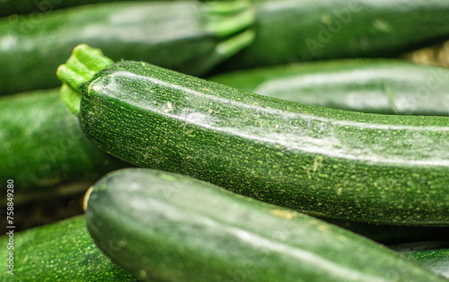 Image of zucchini stocked in market for consumption.