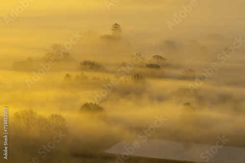 Capturing the Mystical Sunrise at the top Glastonbury Tor: A Stunning Blend of Mist, Sunlight, and Natural Beauty