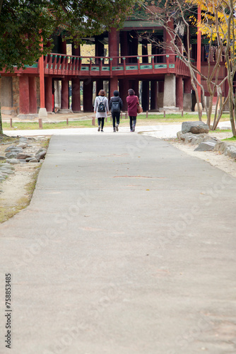 View of the walking female tourist toward to the pavilion photo