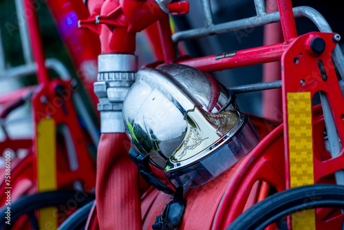French firefighter helmet placed on the back of a fire vehicle