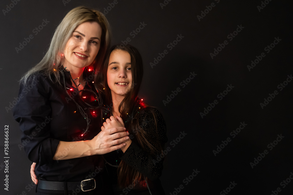 happy Christmas. family mother and kid with Christmas garland happy Christmas. family mother and kid with Christmas garland