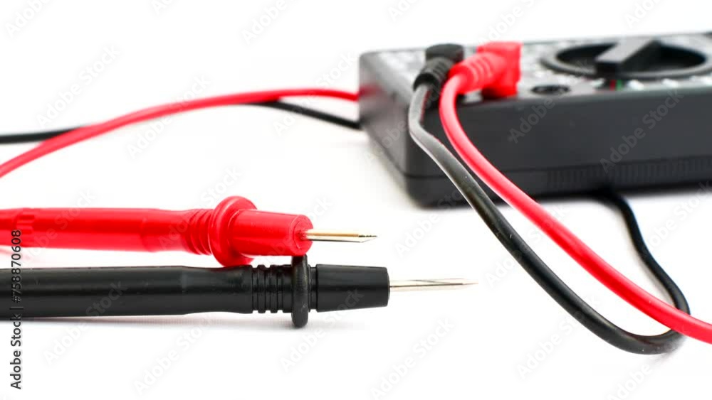 Close-up of a multimeter on a clear surface, highlighting precision and versatility for electrical measurements. Close-up of a multimeter on a clear surface, highlighting precision and versatility for electrical measurements.