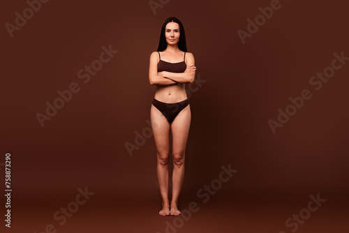 No retouch full body photo of gorgeous self confident woman wear lingerie holding arms crossed isolated on dark brown color background