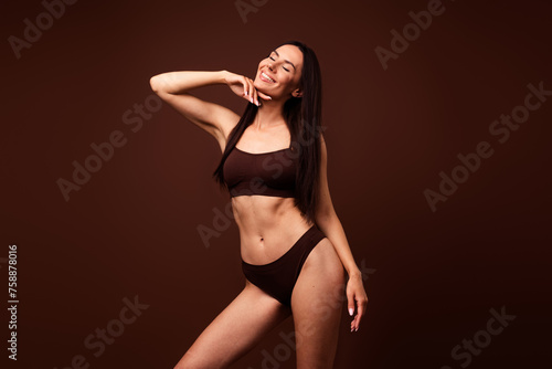 Photo of lovely adorable girl wear trendy lingerie promote body positivity wellness vitality no filter isolated on brown color background © deagreez