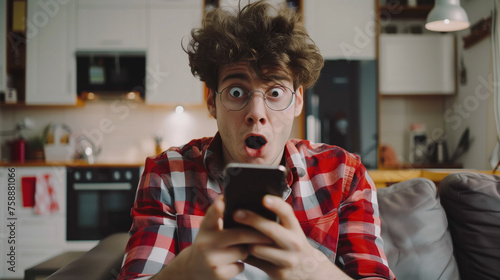 Surprised caucasian man looking at smartphone photo