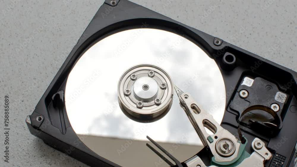 Close-up of a computer HD on a minimalist surface, ready to enhance its capabilities. Computer HDD, symbol of advanced storage, standing out on a simple and functional surface. Close-up of a computer HD on a minimalist surface, ready to enhance its capabilities. Computer HDD, symbol of advanced storage, standing out on a simple and functional surface.
