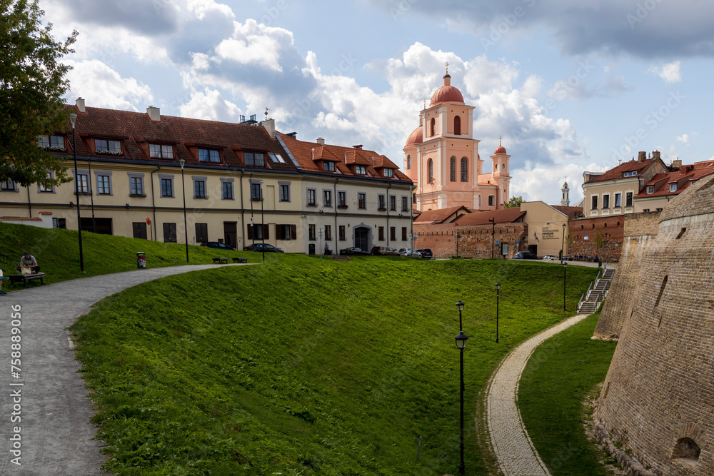 Vilnius, Lithuania - May 1, 2019 . The Bastion of City Wall, Renaissance-style fortification. Church of the Holy Spirit (Sventosios Dvasios Baznycia)