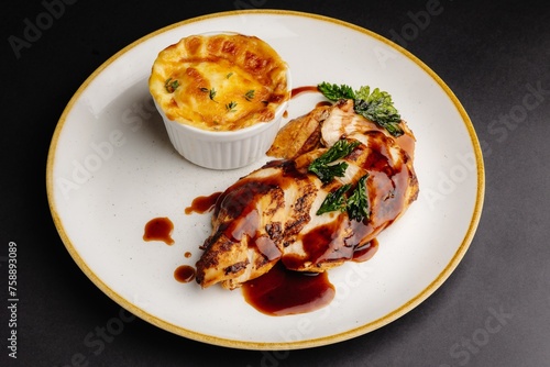 Chicken Breast with Creamy Cheese Sauce, Herbs on White Plate, Cauliflower Cheese Bake