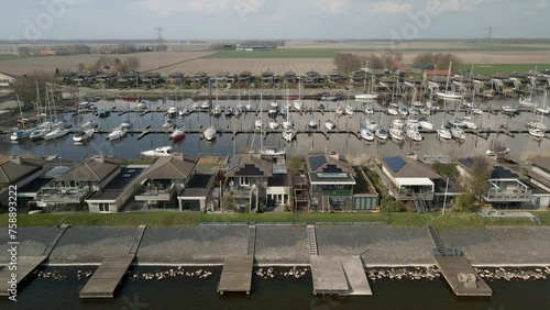 Aerial view of marina with sailboats and houses, Schokkerhaven, Nagele, Netherlands photo