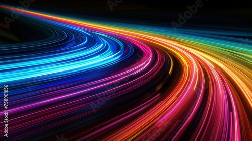 High-speed motion blur on a black background with dynamic rainbow streaks of light. photo