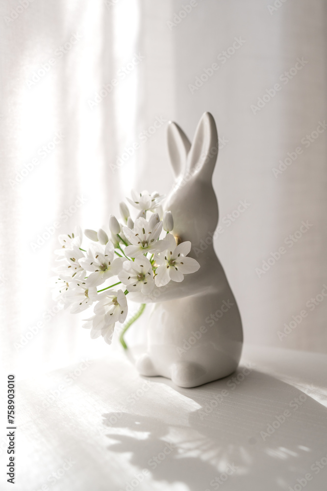 Fototapeta premium easter bunny with flowers, Easter rabbit and flowers, Easter mood, Easter decoration, white flowers