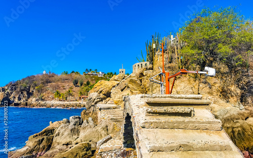 Beautiful rocks cliffs view waves at beach coast panorama Mexico. photo