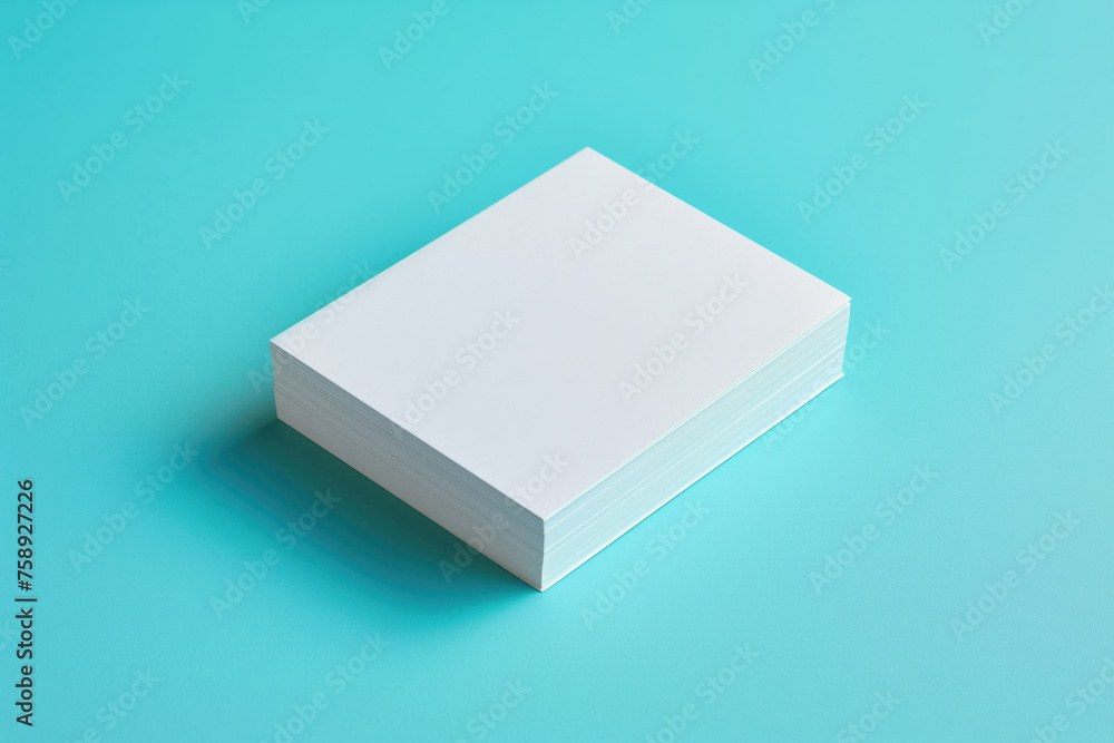 Stack of white paper isolated on blue background, mockup. Stack of white paper isolated on blue background, mockup.