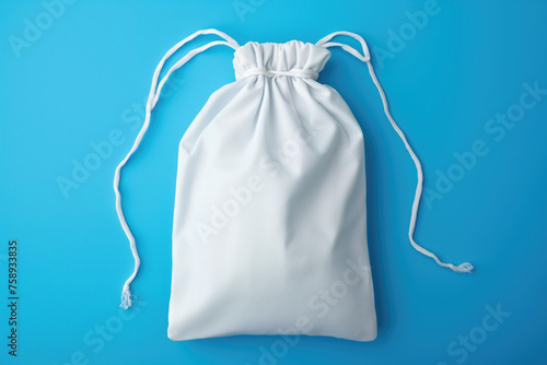  White pouch isolated on blue background, mockup.