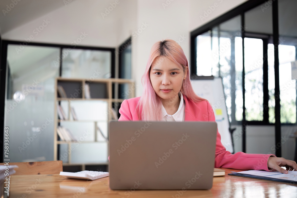 Business woman using calculator for do math finance on wooden desk in office and business working background, tax, accounting, statistics and analytic research concept. Business woman using calculator for do math finance on wooden desk in office and business working background, tax, accounting, statistics and analytic research concept.