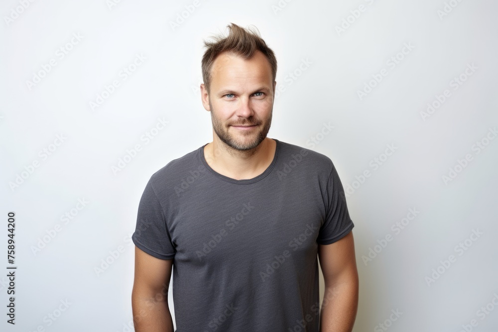 Portrait of a handsome young man in a gray t-shirt Portrait of a handsome young man in a gray t-shirt