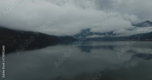 Aerial view of Caldonazzo Lake with foggy dolomites in winter, Trento, Italy. photo