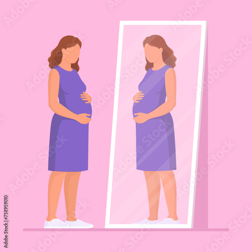 Pregnant woman looking at herself in the mirror