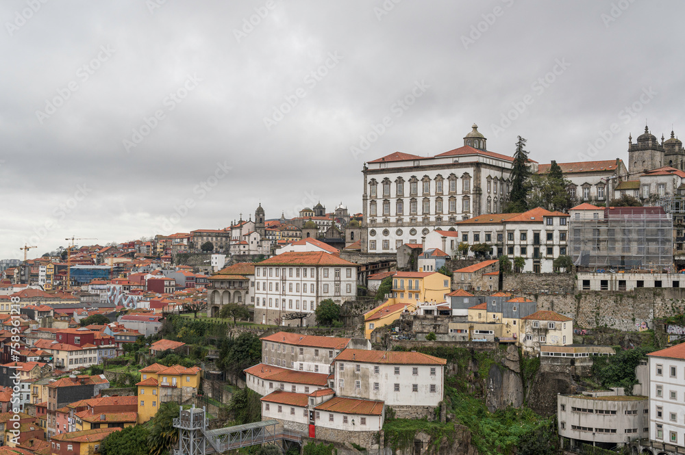 The buildings of Porto city, Portugal, with Porto Cathedral overlooking it all. The city is famous for the export of Port, a fortified wine