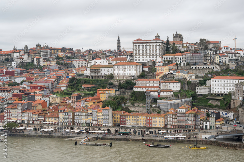 View of Porto city at the riverbank (Ribeira quarter) and Porto Cathedral, Portugal, a UNESCO World Heritage City.