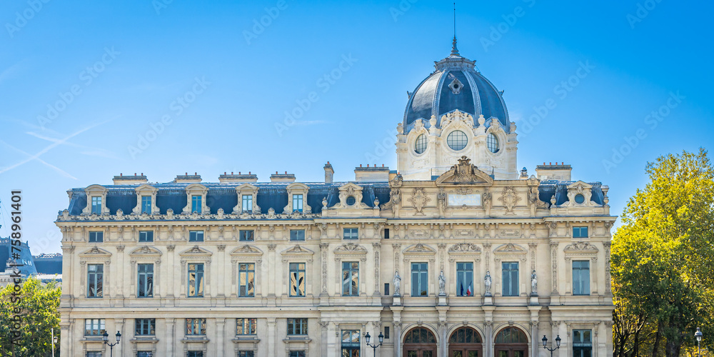 Front facade of the Commercial Court building along the Seine river in Paris, France