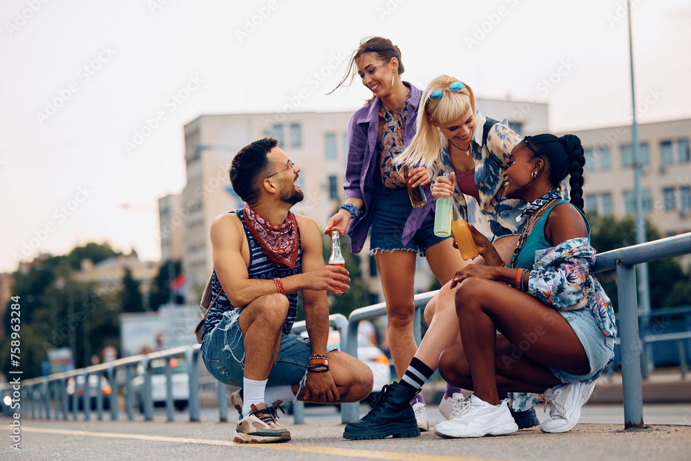 Fototapeta premium Group of happy festival goers having fun in city.