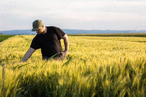 Young farmer in wheat fields © Dusan Kostic