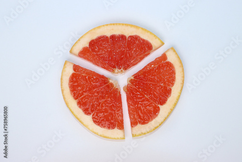 fresh red sliced ​​and dewy grapefruit  © Marie