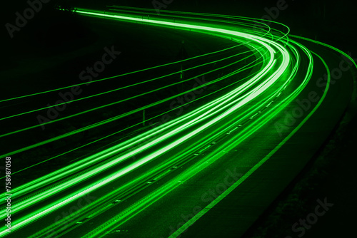 green car lights at night. long exposure