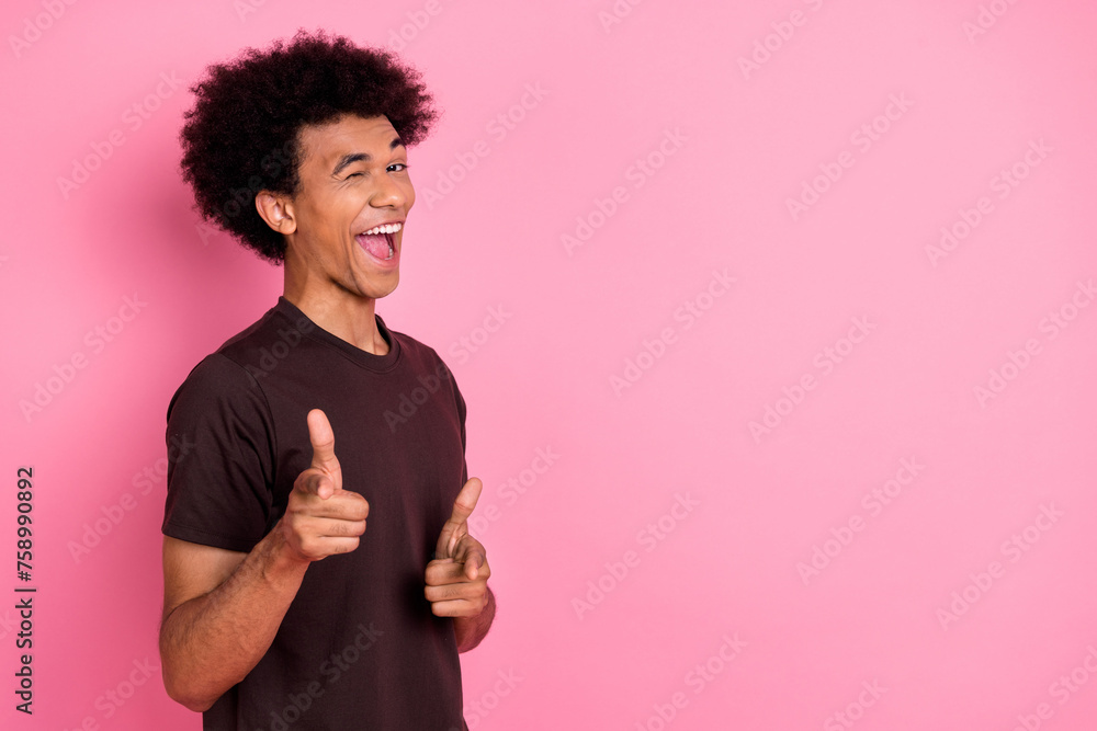 Photo of cool young guy chevelure hairstyle handsome macho indicating fingers you blink eye flirting isolated on pink color background Photo of cool young guy chevelure hairstyle handsome macho indicating fingers you blink eye flirting isolated on pink color background
