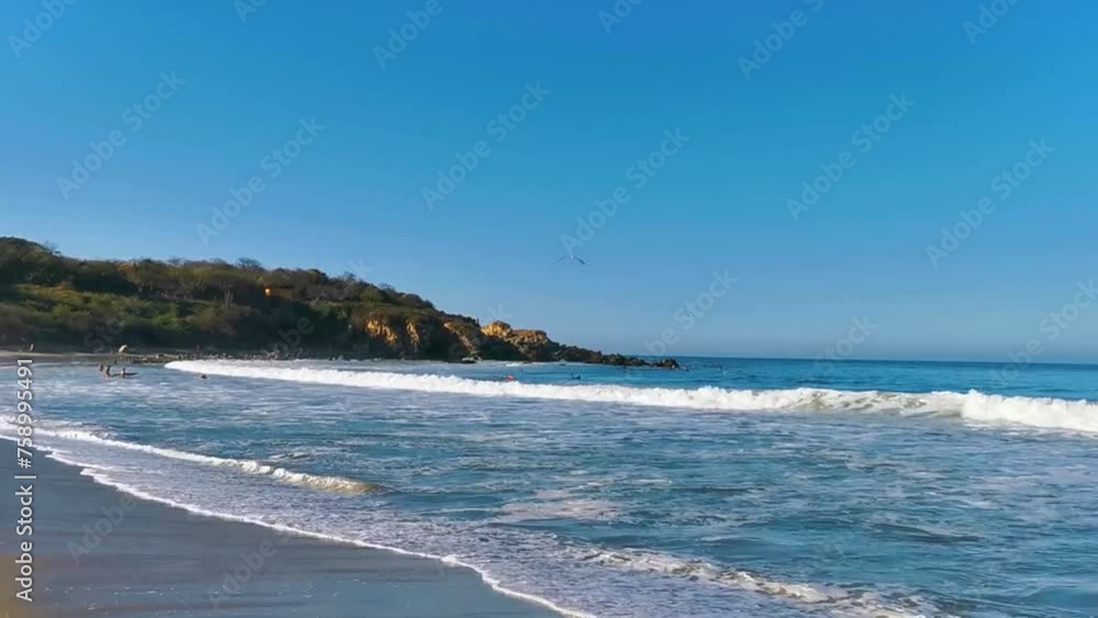 Surfer surfing on surfboard on high waves in Puerto Escondido Mexico.