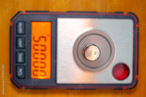 high-precision scale on a thousandth scale with a digital display representing 50, 000g.