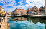 Landmarks and beautiful places (cities) of northern Italy - elegant Trieste town with charming streets and canals