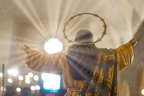 jesus christ with his back and open arms towards the light inside the Igreja Matriz de Colares Nossa Senhora da Assunção photo