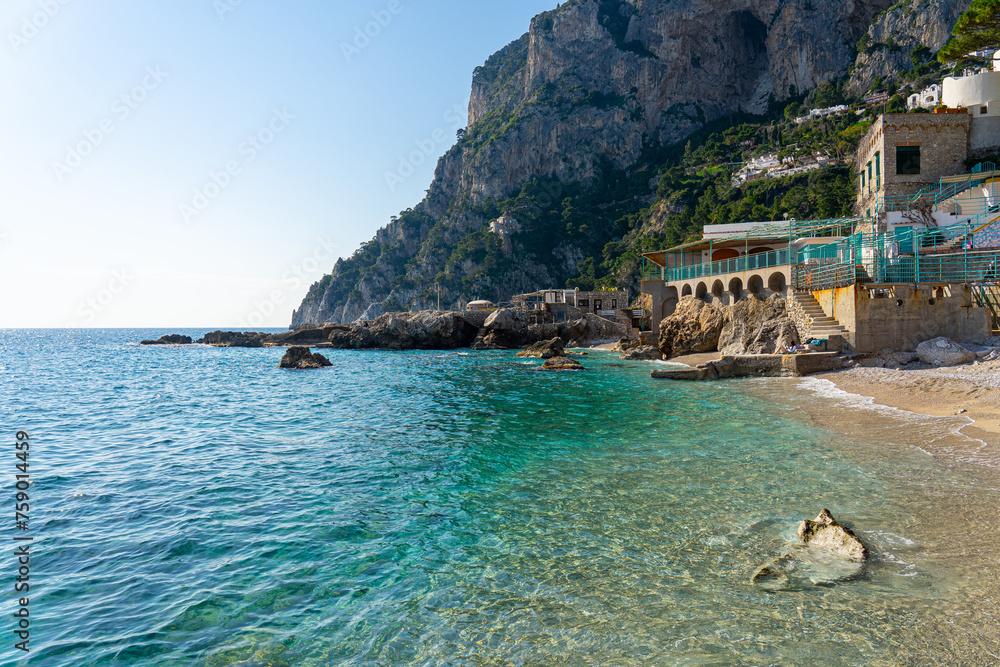 Bay on the island of Capri with crystal clear turquoise sea water, Italy