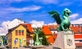 Travel and landmarks of Slovenia - beautiful Ljubljana with famous Dragon's bridge and colorful houses.