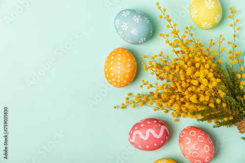 Canvas Print Easter eggs with mimosa flowers on a bright background