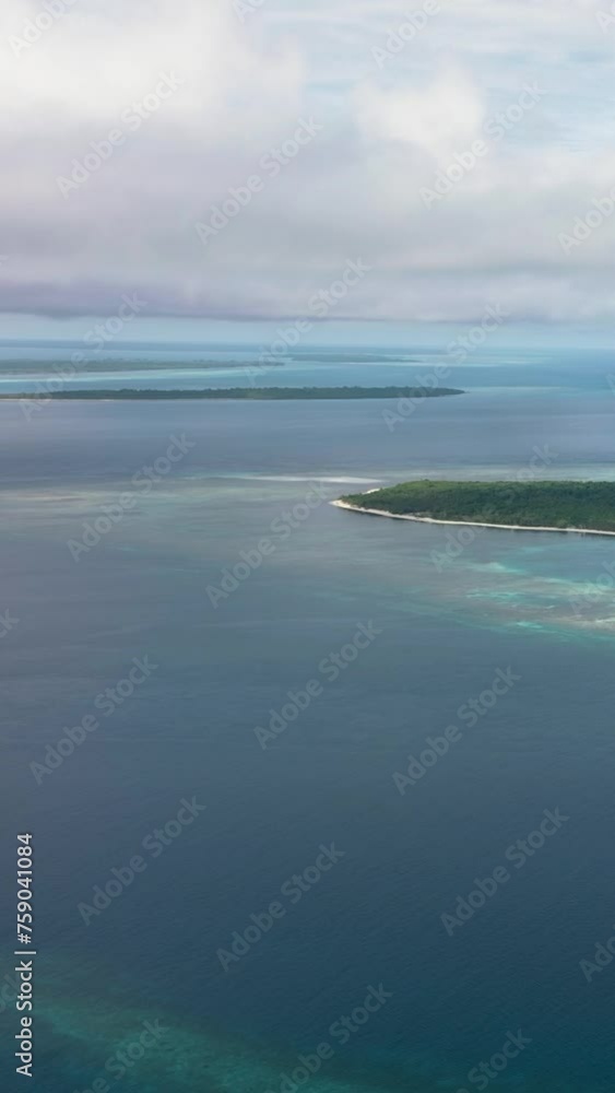 Aerial drone of tropical island in the blue sea with a coral reef and the beach. Balabac, Palawan. Philippines. Aerial drone of tropical island in the blue sea with a coral reef and the beach. Balabac, Palawan. Philippines.
