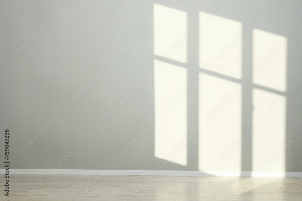 Light and shadows from window on wall indoors Light and shadows from window on wall indoors